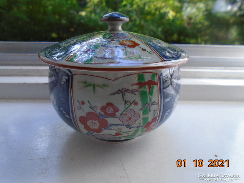 Hand-painted, hand-marked cup with imari and blue white flower patterns on gray jade glaze