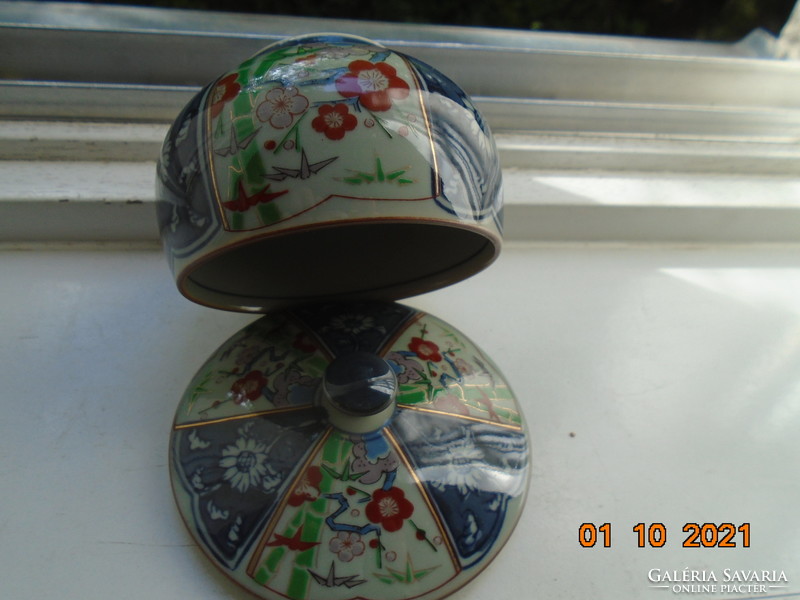 Hand-painted, hand-marked cup with imari and blue white flower patterns on gray jade glaze