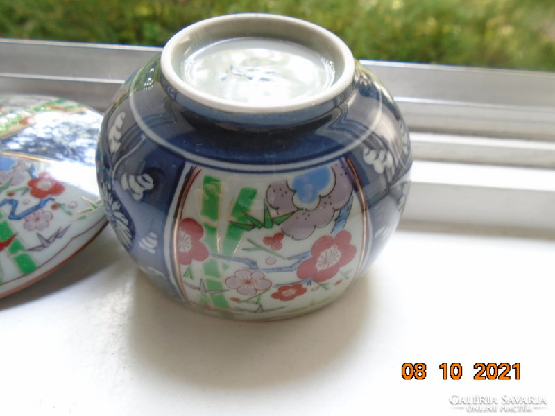 Hand-painted, hand-marked cup with imari and blue white flower patterns on gray jade glaze