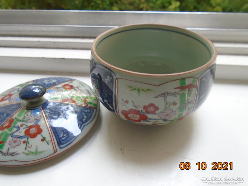 Hand-painted, hand-marked cup with imari and blue white flower patterns on gray jade glaze