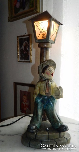 Kurt is a ceramic ceramic: a newsboy boy sculpture lamp