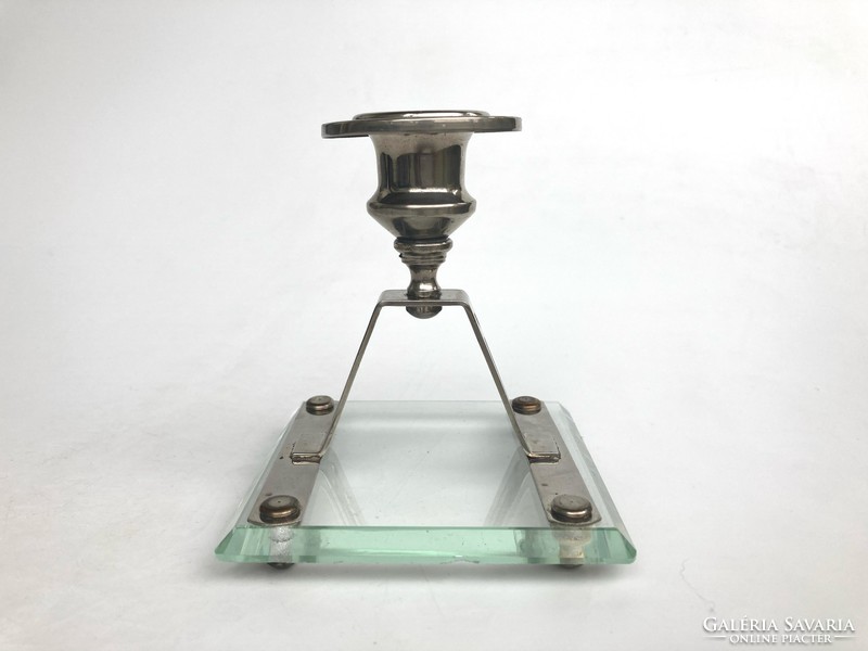 Art deco candle holder with polished glass base on metal legs