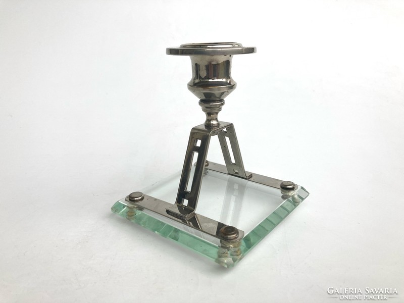 Art deco candle holder with polished glass base on metal legs