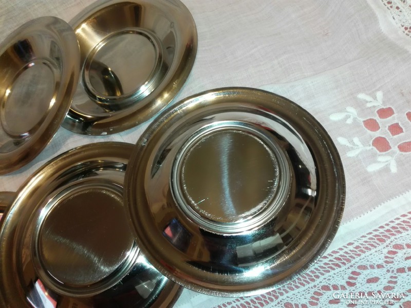 Glass saucers with metal saucers.