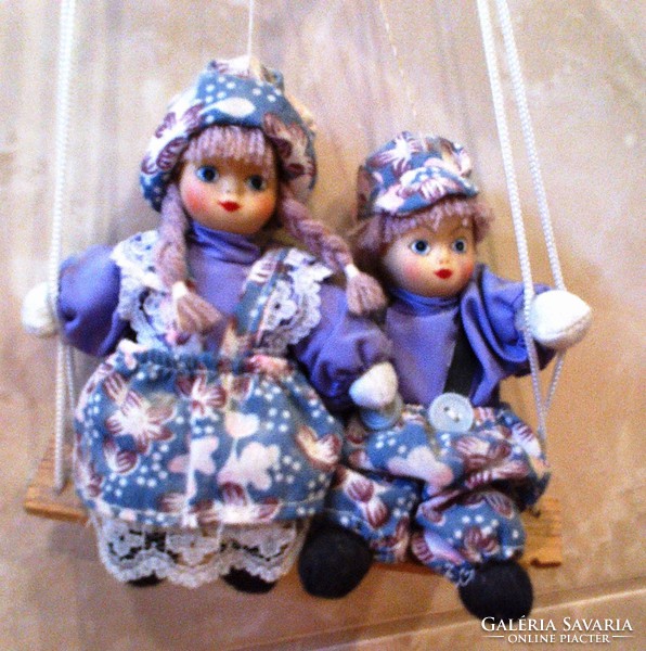 Also for collectors, a pair of rocking dolls for sale