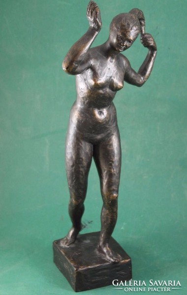 Tamás Gyenes: statue of a naked woman combing - small sculpture