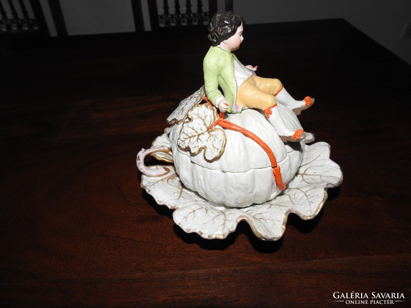 Antique figural bonbonier - little boy sitting on a giant pumpkin