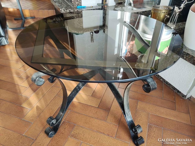 Glass table with hand forged plinth
