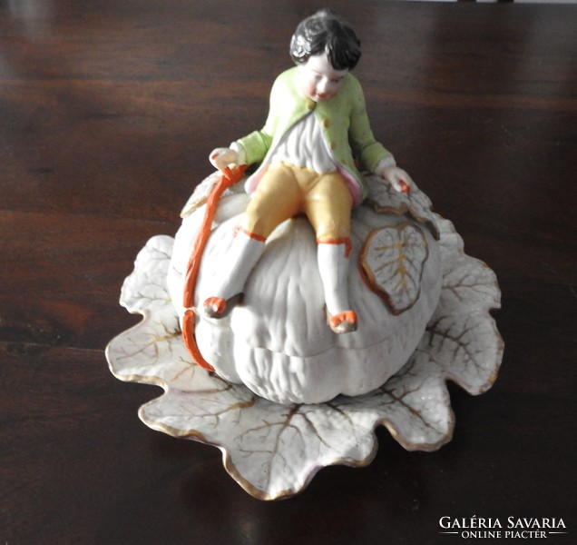 Antique figural bonbonier - little boy sitting on a giant pumpkin