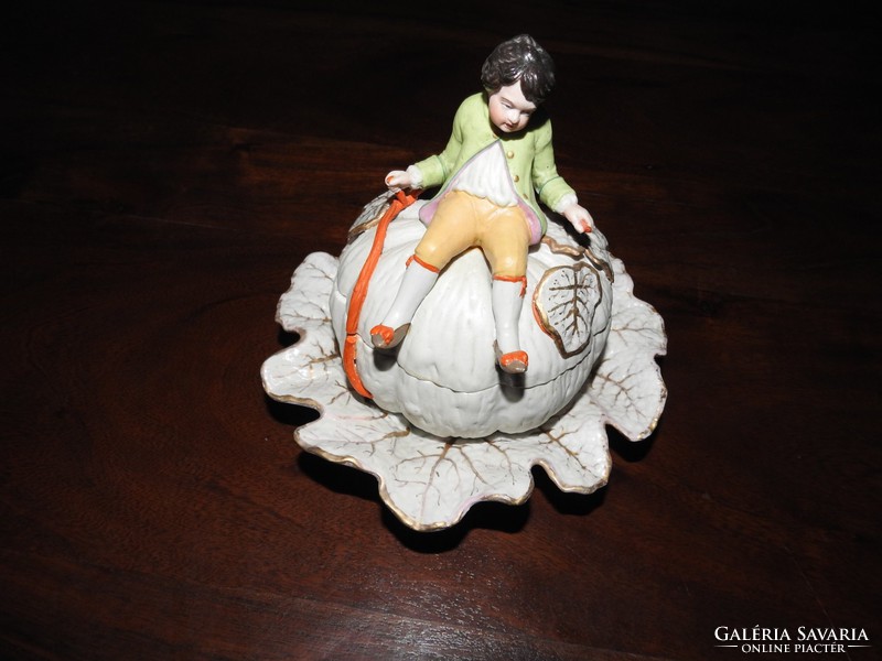 Antique figural bonbonier - little boy sitting on a giant pumpkin