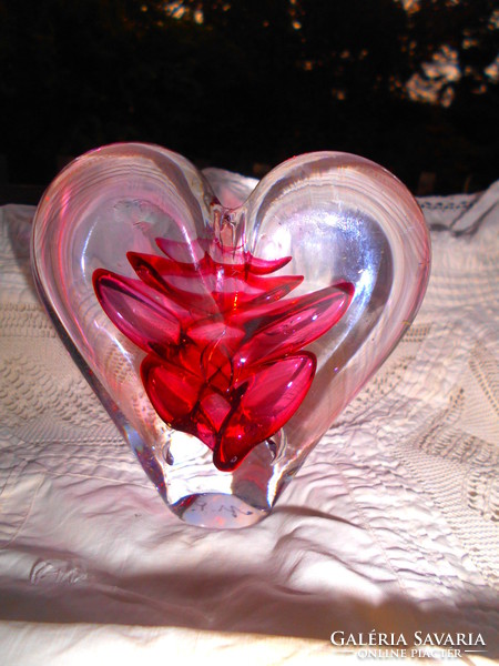 A heart-shaped paperweight with a master signature on the sole