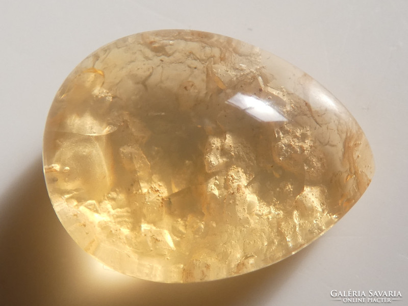 A precious stone polished from a combination of natural quartz, opal and kaolinite. 2.9 Ct