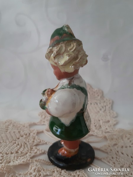 Old little girl and boy in ceramics in Bavarian national costume