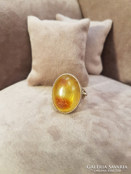 Silver ring with polish amber
