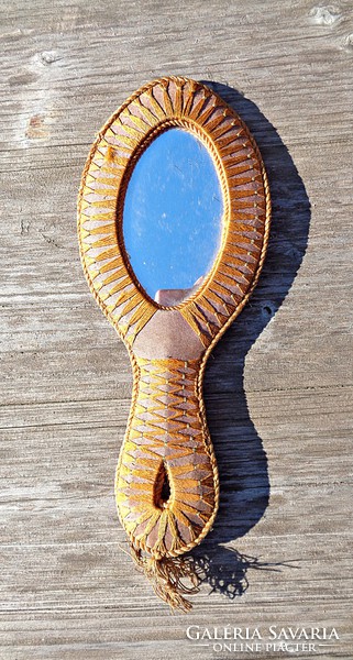 Antique hand mirror with photo on the back