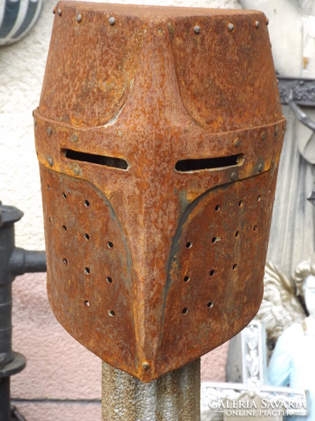 Beautiful medieval knight in helmet fit helmet in cavalry loft industrial