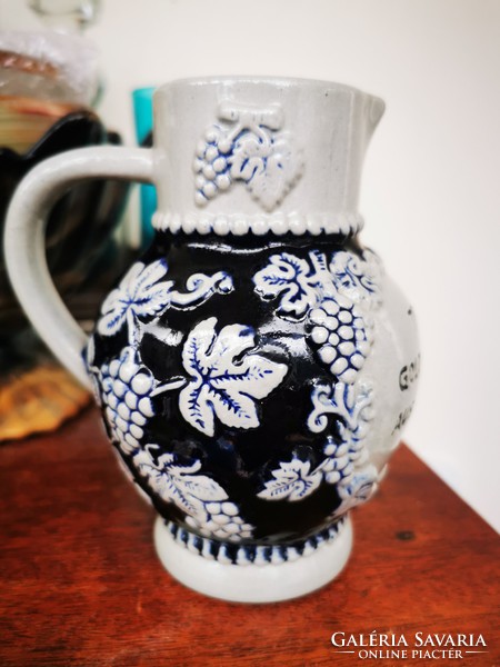 German wine jug with bunch of grapes