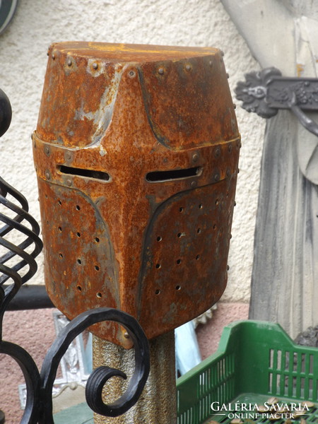 Beautiful medieval knight in helmet fit helmet in cavalry loft industrial