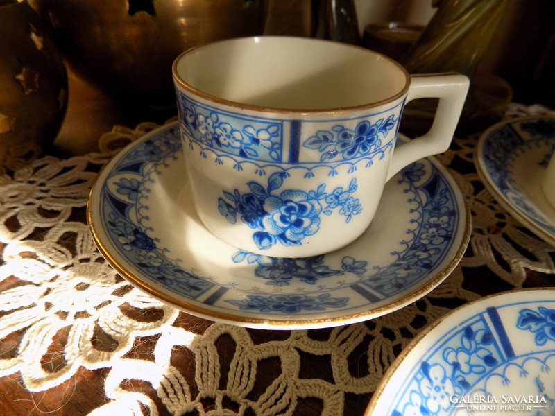 Two small cups with three plates