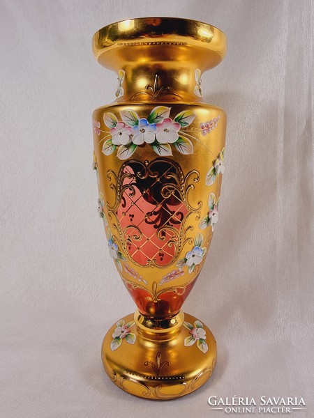 Bohemian red amphora in enameled gold-painted glass vase.