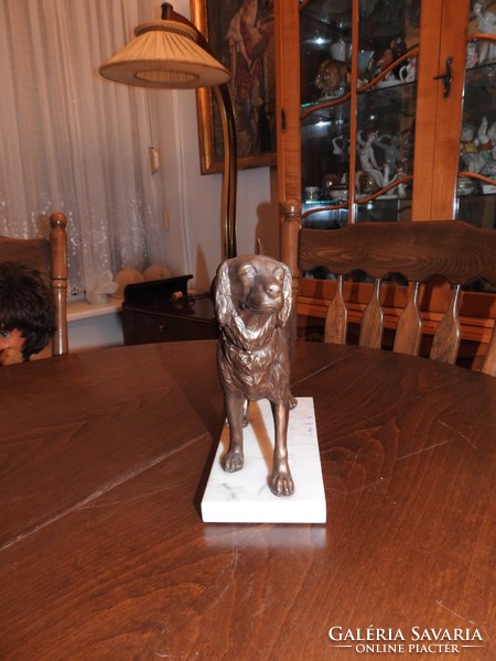 Antique bronzed shepherd dog on marble pedestal