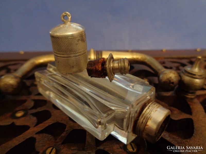 Antique perfume bottle with silver cap