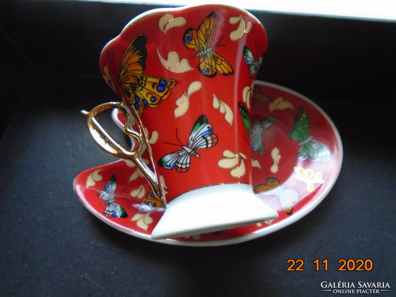 Hand-painted gold-contoured colorful butterfly patterns with interesting shapes in a coffee set box