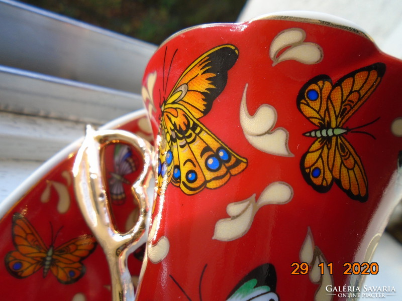 Hand-painted gold-contoured colorful butterfly patterns with interesting shapes in a coffee set box