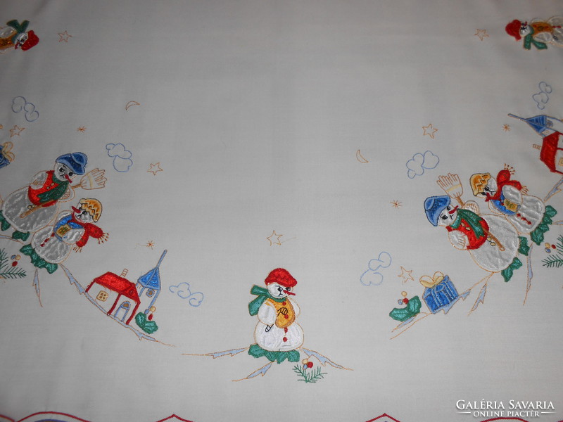 Embroidered tablecloth with snowman.