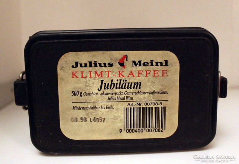 Old buckled metal box with julius meinl klimt anniversary edition