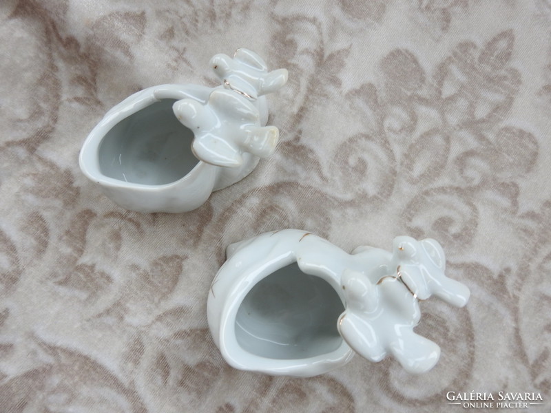 Pair of porcelain jewelry holders holding old wedding rings