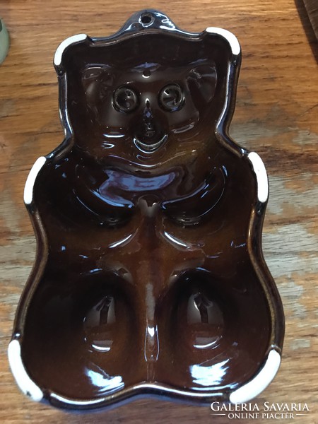 Teddy bear in ceramic baking tin