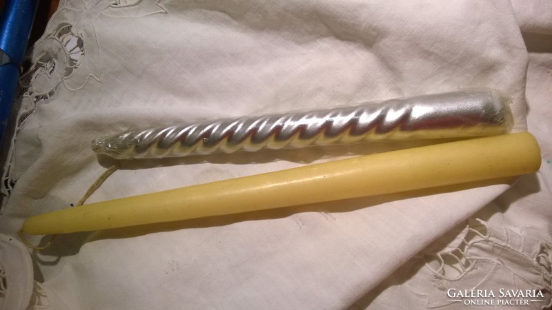 2 large silver and yellow candles