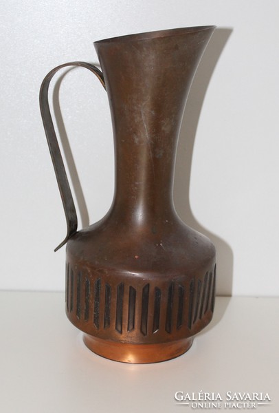 Large copper jug pouring