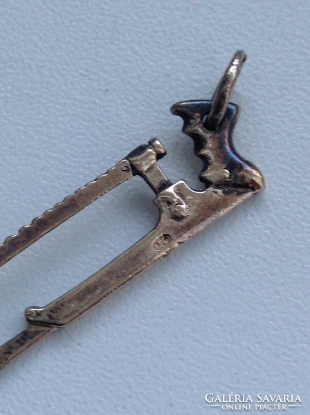 Old gilded silver medical saw pendant