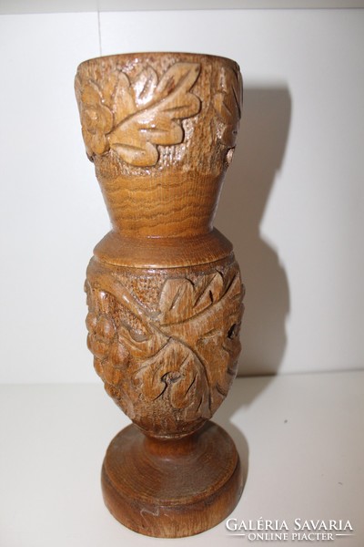 Large carved wooden vase with grape motif