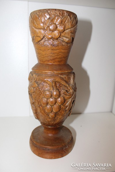 Large carved wooden vase with grape motif