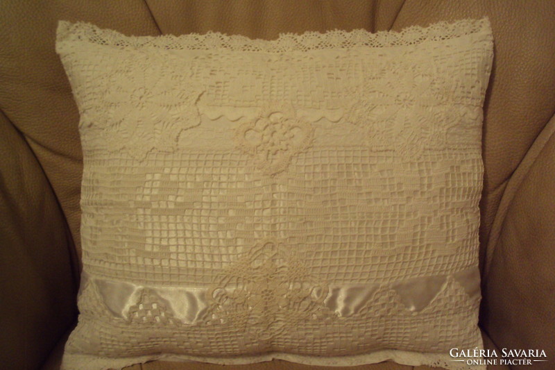 Vintage decorative pillow with antique lace appliqué.