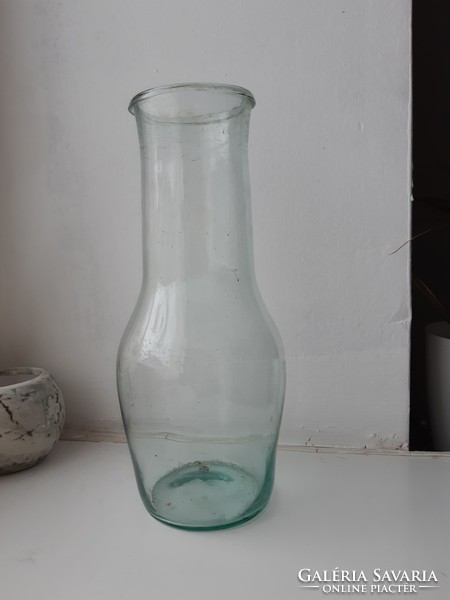 Blown teal glass bottle