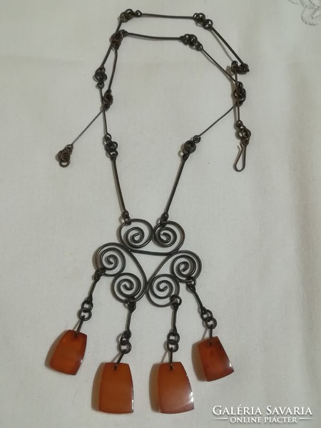 Antique chain with a pendant decorated with amber.