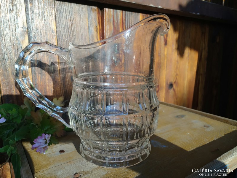 Nice lined old glass pitcher pouring