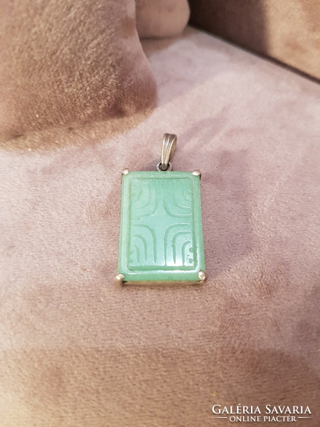 Silver pendant with engraved jade stone