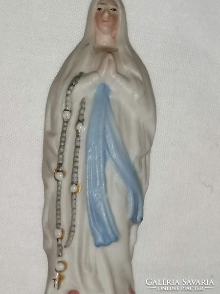 Antique statue of the Virgin Mary of Lourdes.