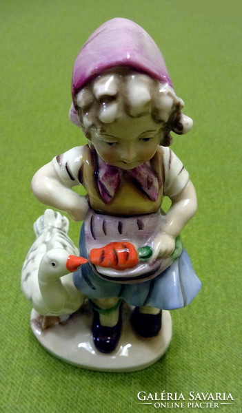 Porcelain little girl with goose