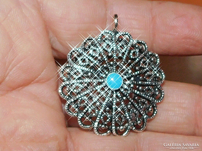 Antique Tibetan silver pendant with ornate openwork pattern