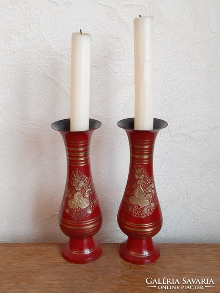 Pair of golden floral metal threaded candlesticks on a red background from the legacy of László Ink