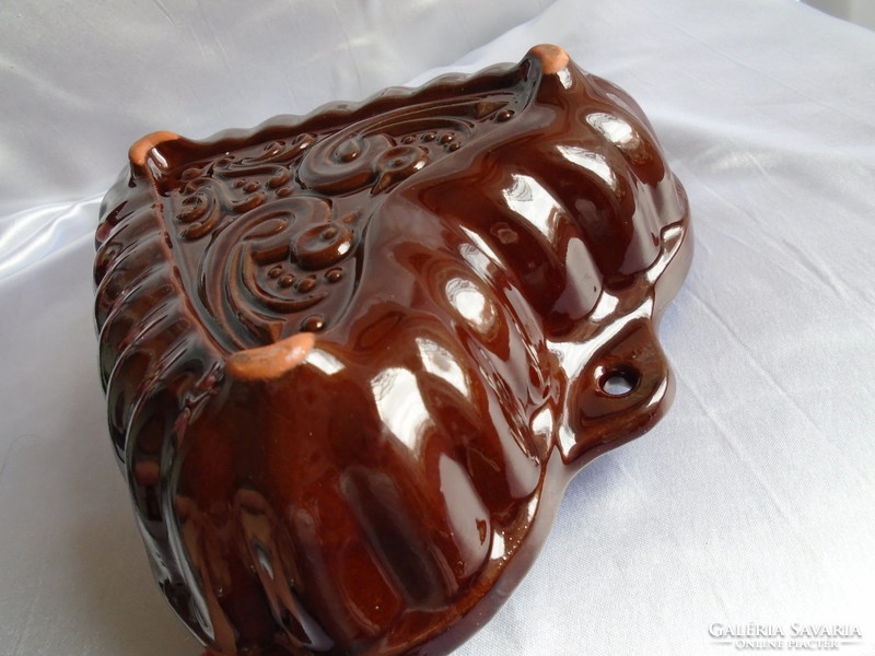 Heart-shaped marked glazed ceramic baking dish.