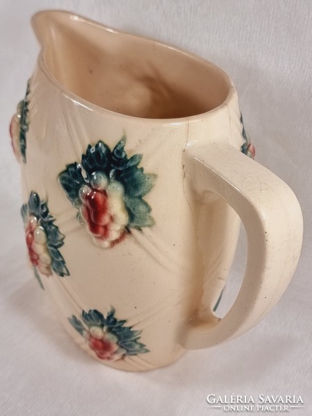 Digoin sarreguemines jug with light colored embossed grape motifs.