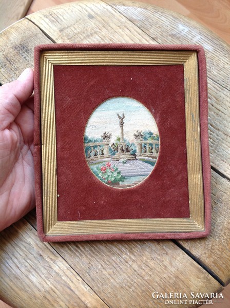 Antique needle tapestry in a velvet frame