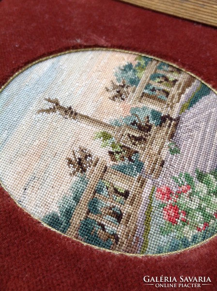 Antique needle tapestry in a velvet frame